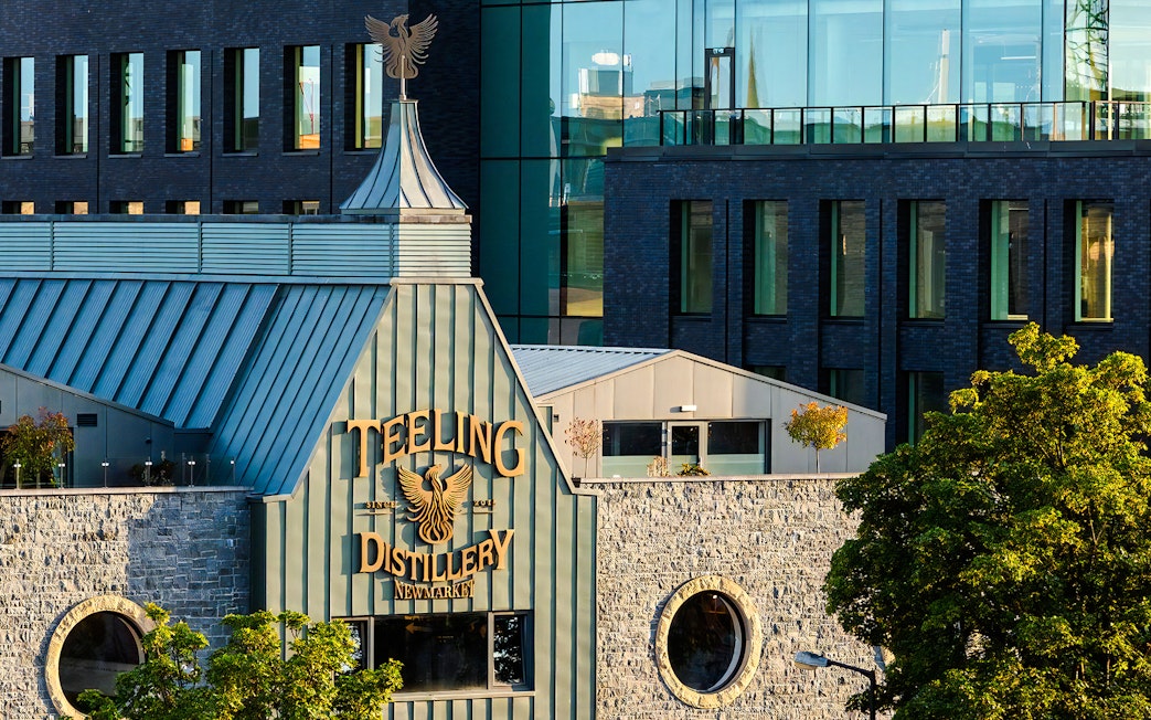Teeling Whiskey Distillery exterior with stone facade and modern glass windows in Dublin.