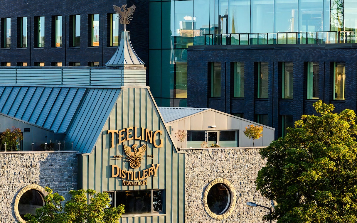 Teeling Whiskey Distillery exterior with stone facade and modern glass windows in Dublin.