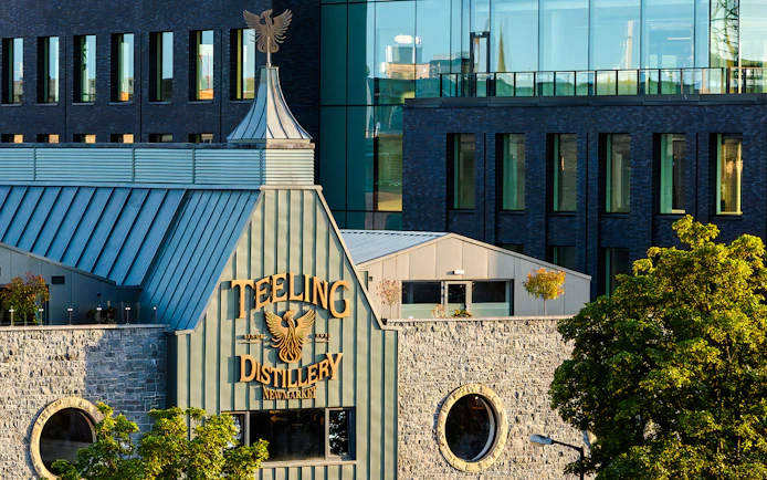 Teeling Whiskey Distillery exterior with stone facade and modern glass windows in Dublin.