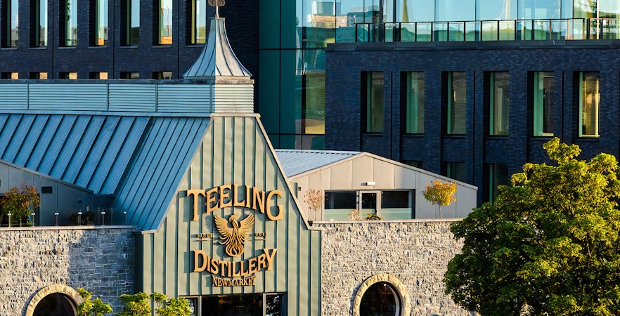 Teeling Whiskey Distillery exterior with stone facade and modern glass windows in Dublin.