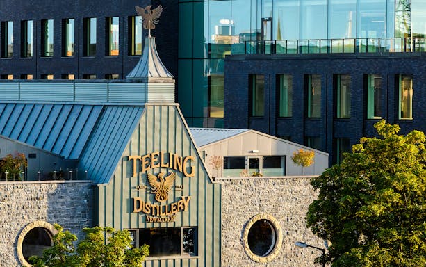 Teeling Whiskey Distillery exterior with stone facade and modern glass windows in Dublin.