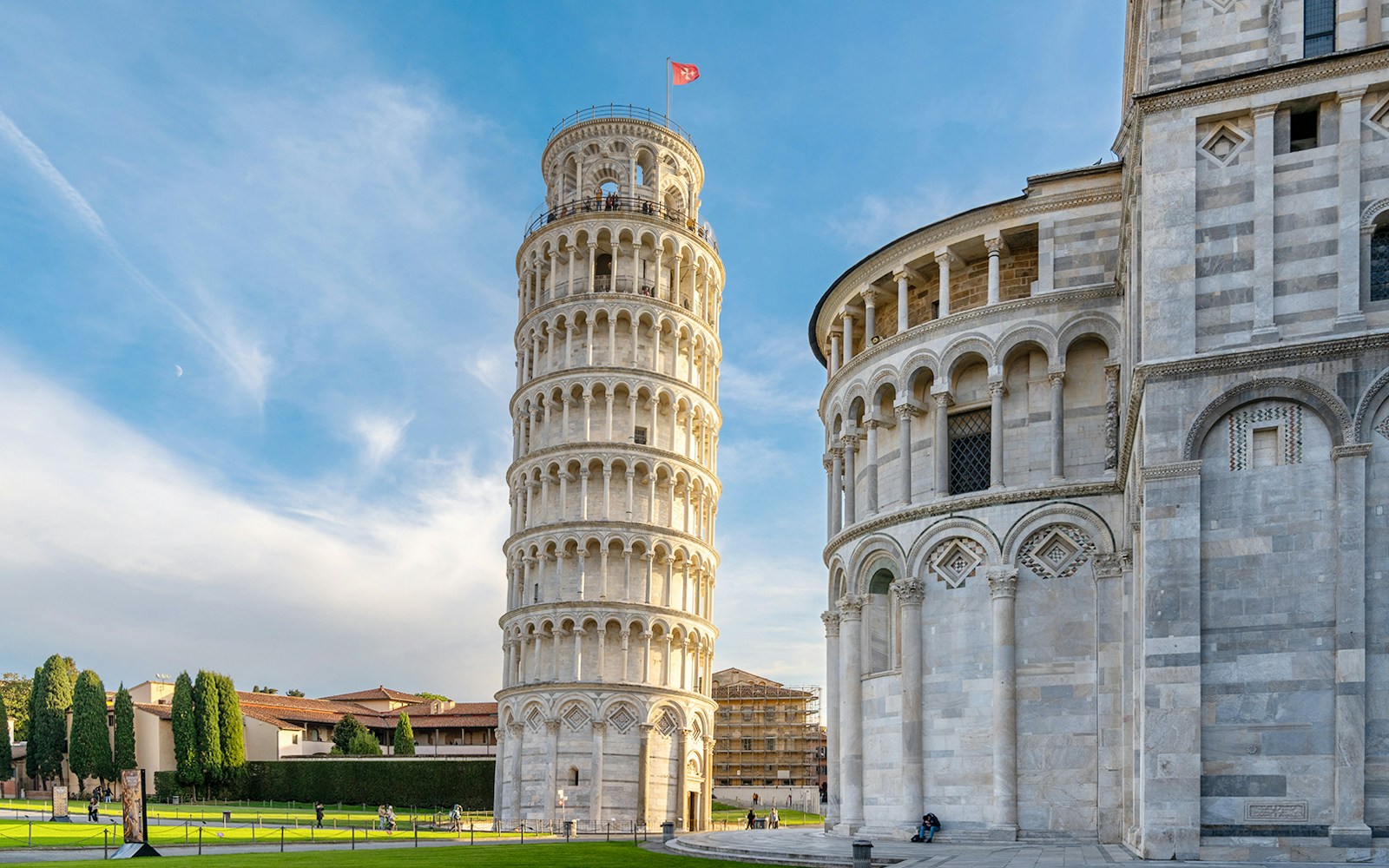Pisa Cathedral and Leaning Tower with tour group in foreground, Pisa, Italy.
