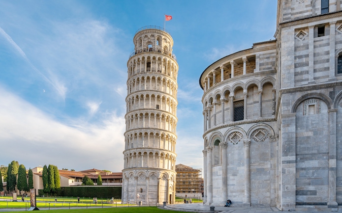 Pisa Cathedral and Leaning Tower with tour group in foreground, Pisa, Italy.