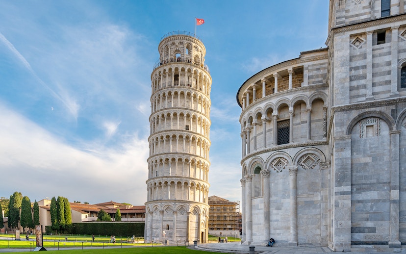 Pisa Cathedral and Leaning Tower with tour group in foreground, Pisa, Italy.
