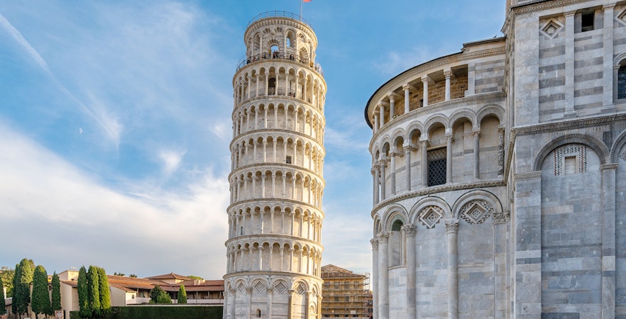 Pisa Cathedral and Leaning Tower with tour group in foreground, Pisa, Italy.