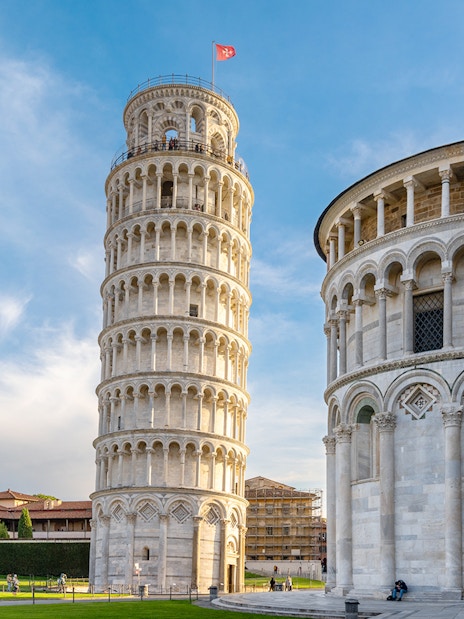 Pisa Cathedral and Leaning Tower with tour group in foreground, Pisa, Italy.