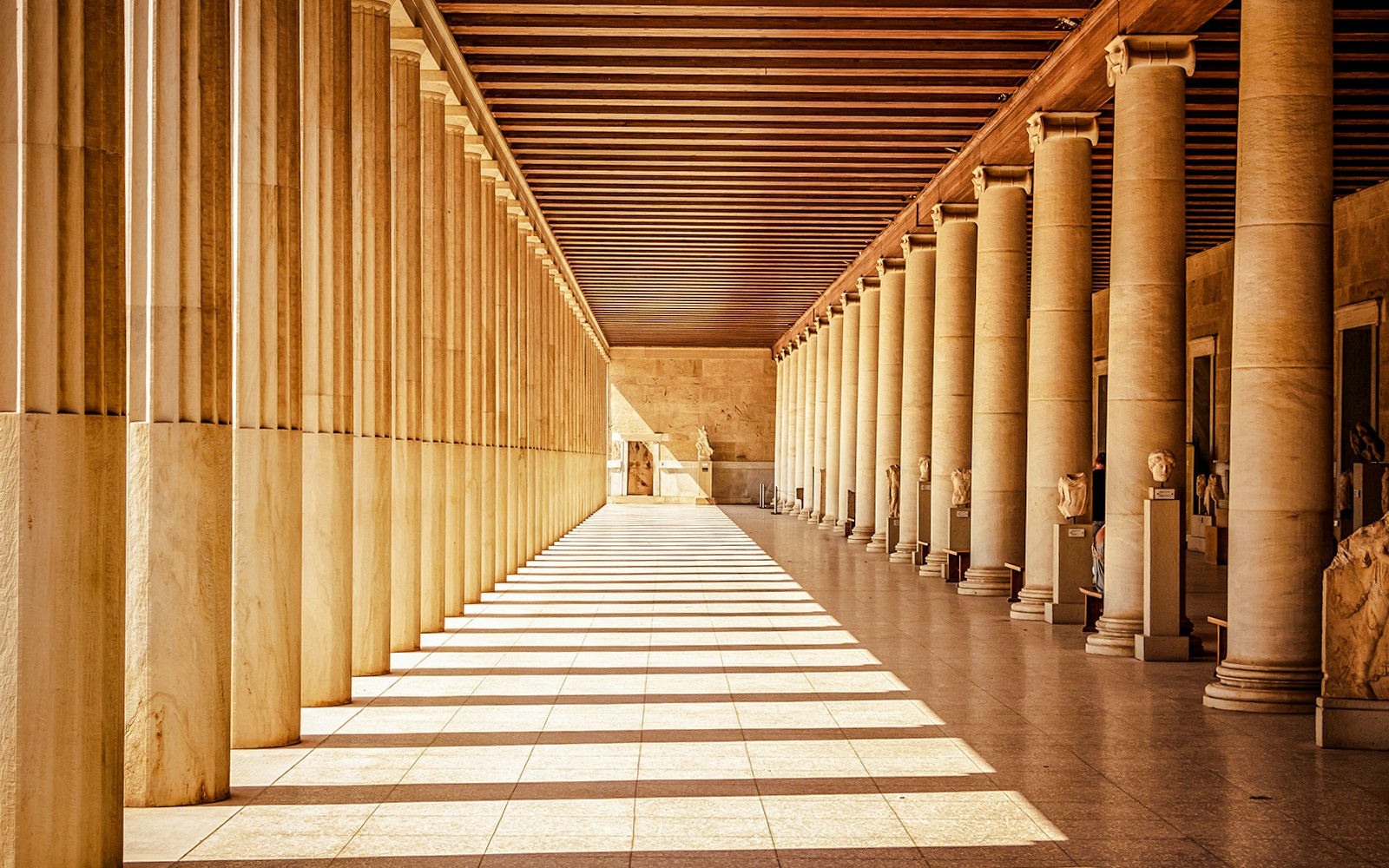 Stoa of Attalos interior with columns and statues, ancient agora, Athens.
