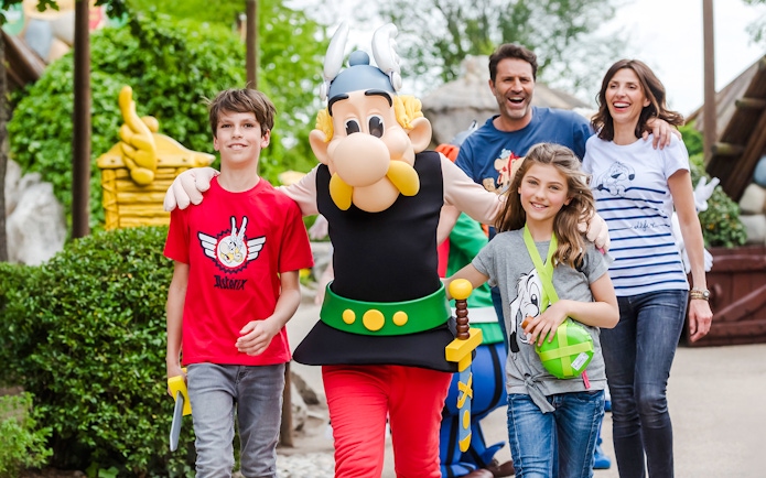 Visitors enjoying a walk with Asterix character at Asterix Park.