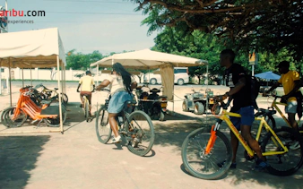 Cyclists starting a village tour on bikes at Diani Beach with hotel pick-up.