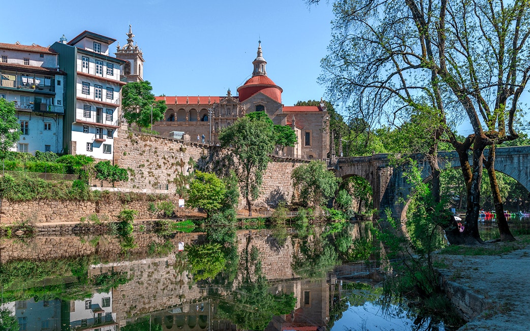 Douro Historical Tour: scenic view of Porto's architecture and river reflection.