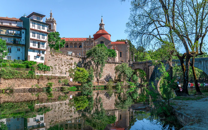 Douro Historical Tour: scenic view of Porto's architecture and river reflection.