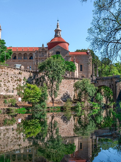 Douro Historical Tour: scenic view of Porto's architecture and river reflection.