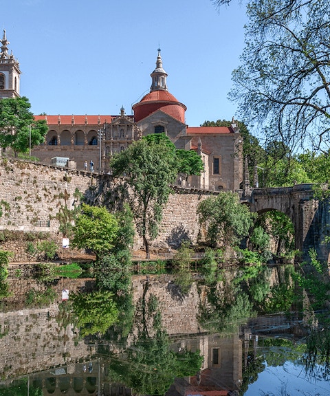 Douro Historical Tour: scenic view of Porto's architecture and river reflection.