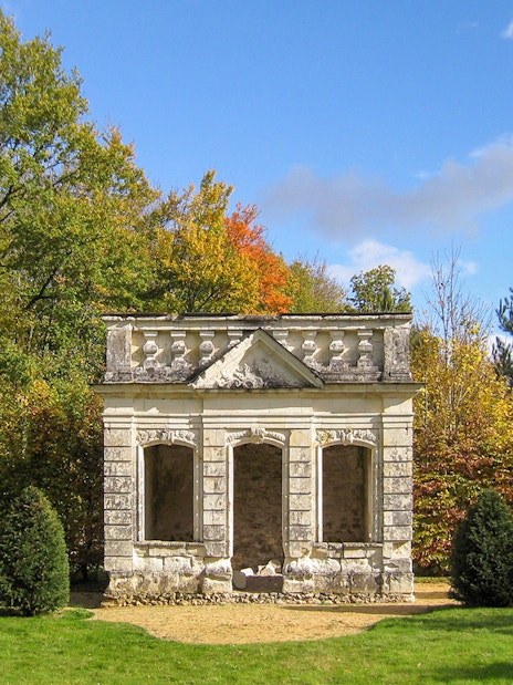 Trianon structure surrounded by trees at Château de Chenonceau, Loire Valley.