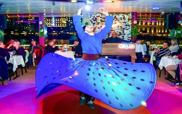 Whirling dervish performance on Bosphorus night cruise with live entertainment.