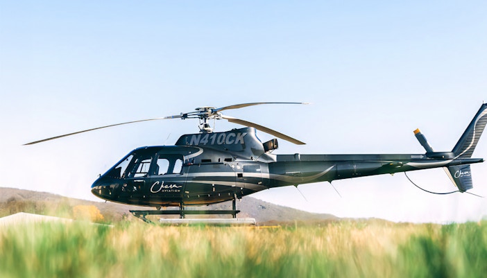 Helicopter on grass field for NYC tour from New Jersey.