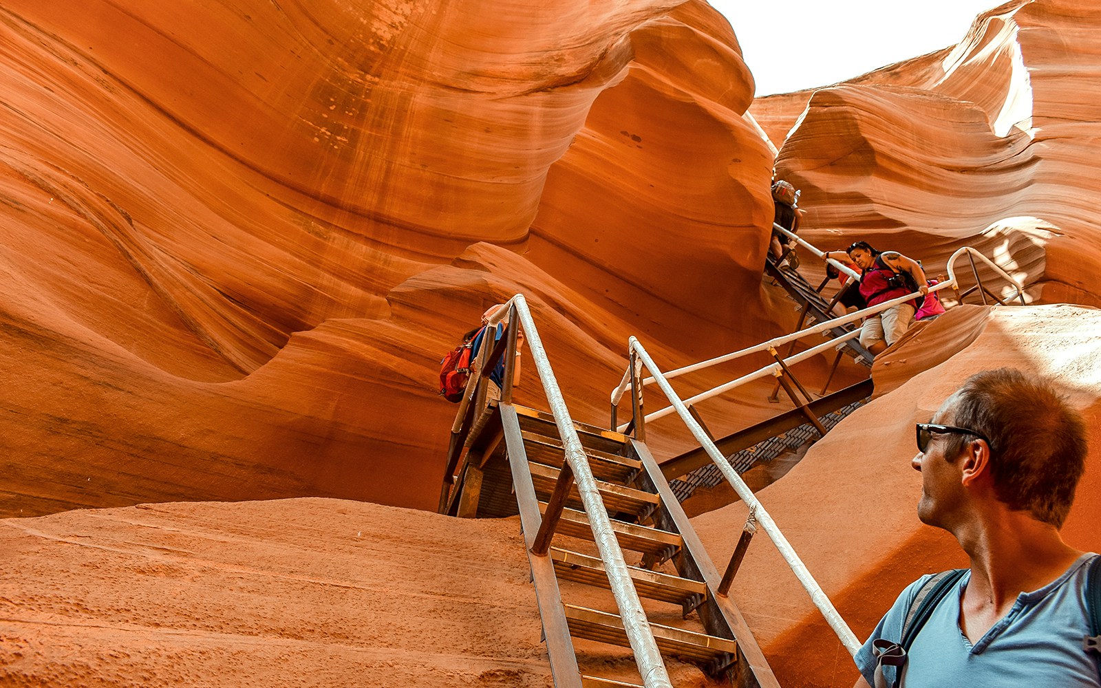 Tourists climbing stairs in Lower Antelope Canyon, Arizona, during a day tour from Las Vegas.