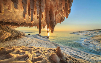 Salt formations at sunrise on the Dead Sea shoreline during a tour from Amman.