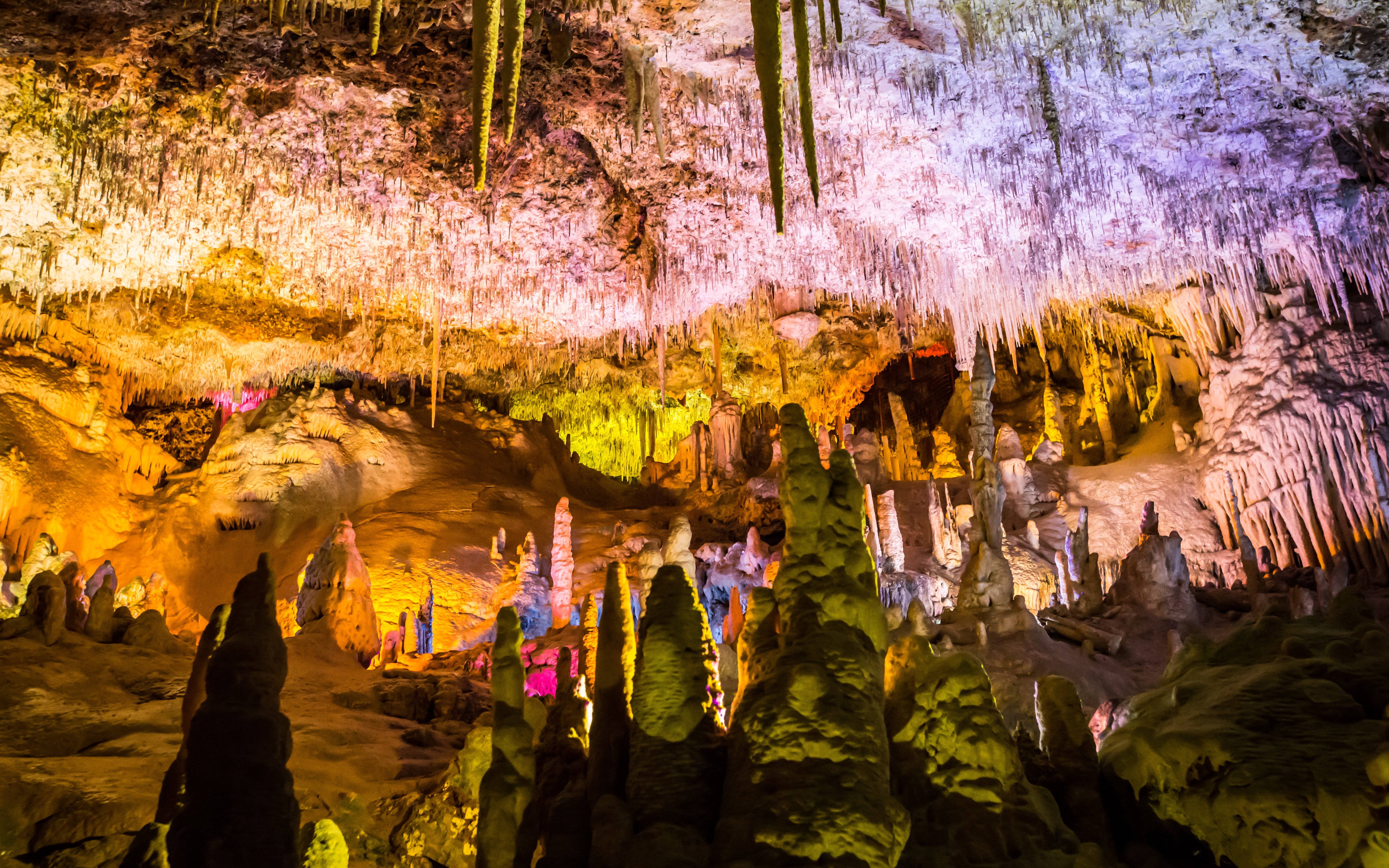 Stalactites and stalagmites in illuminated Drach Caves, Mallorca.