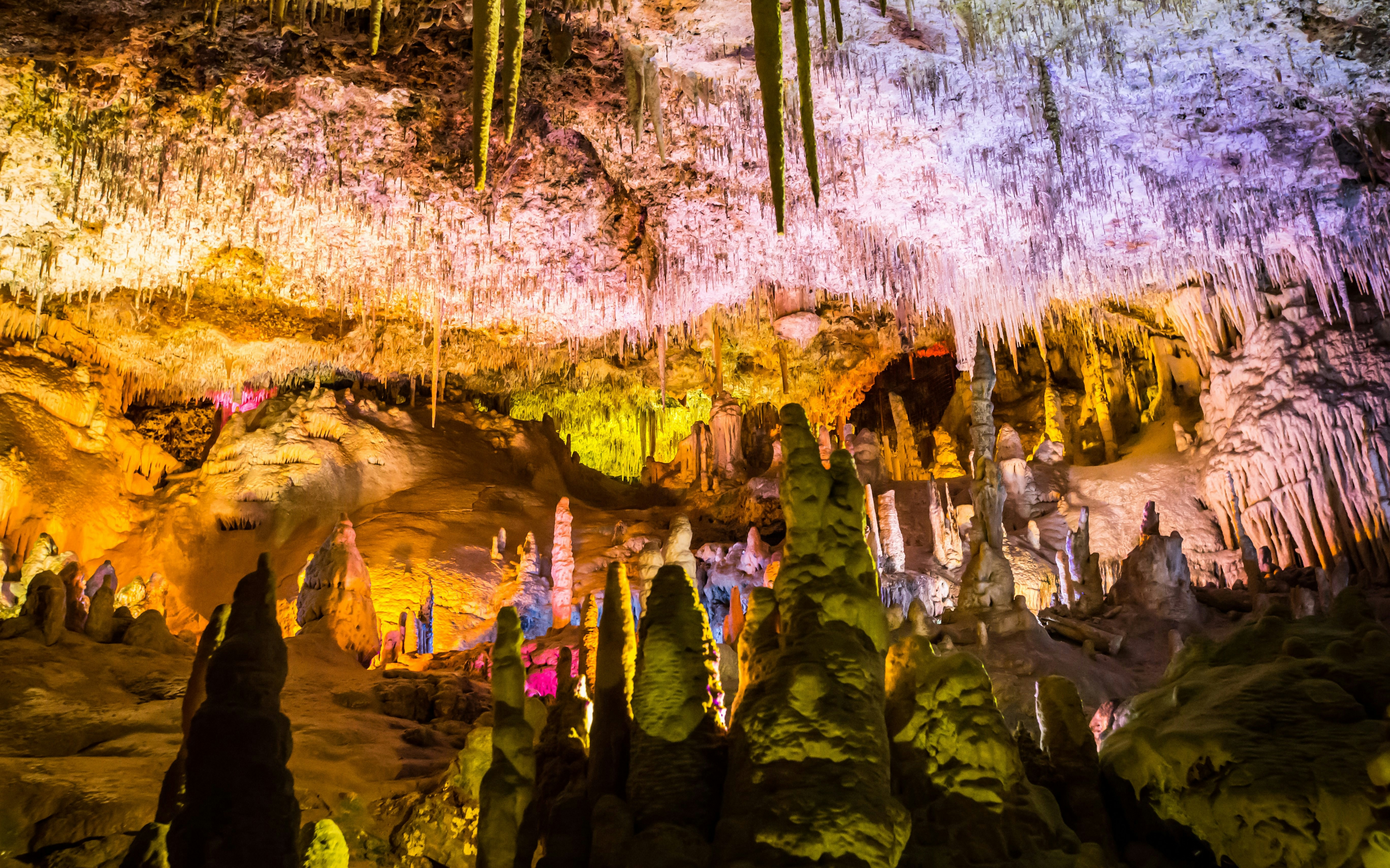 Stalactites and stalagmites in illuminated Drach Caves, Mallorca.