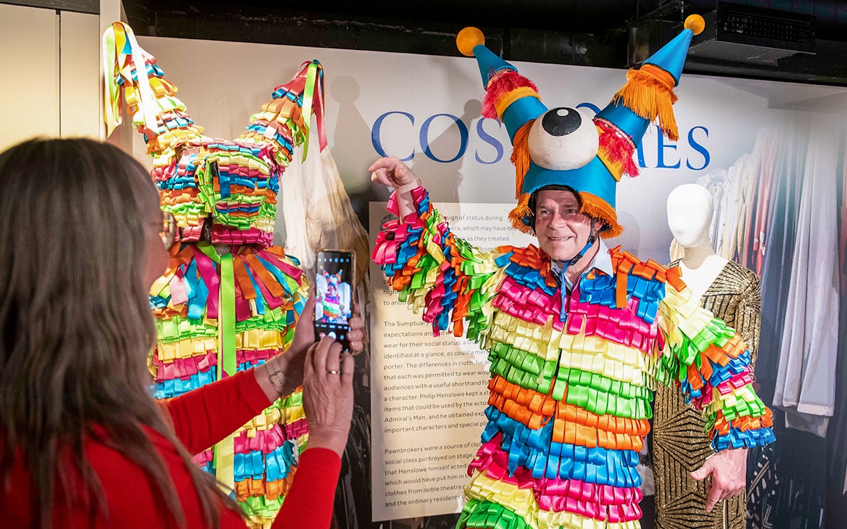 Colorful costume display at Globe Story and Guided Tours exhibit.