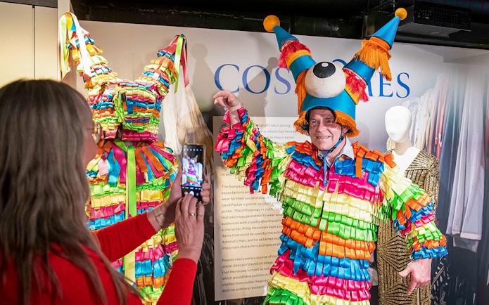Colorful costume display at Globe Story and Guided Tours exhibit.