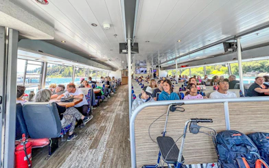 Sightseeing boat interior with passengers on Nahuel Huapi Lake, Argentina.