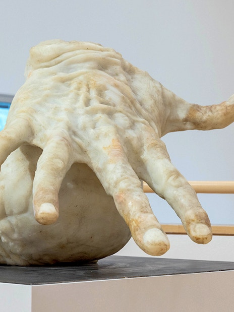 Sculpture of a large hand inside ALBERTINA KLOSTERNEUBURG exhibit.