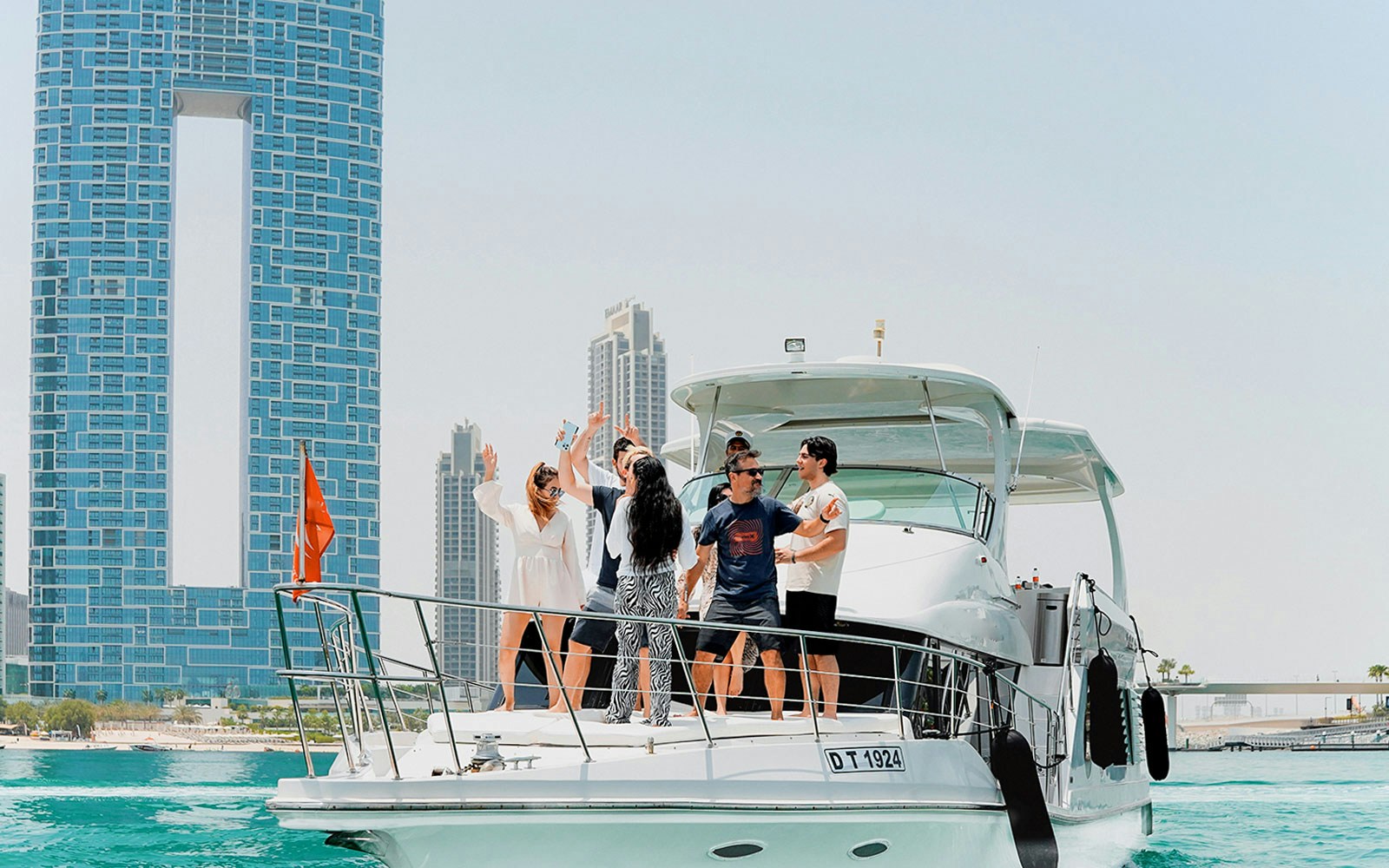 Sightseeing yacht cruise with Bluewater Yacht and JBR skyline in Dubai Marina.