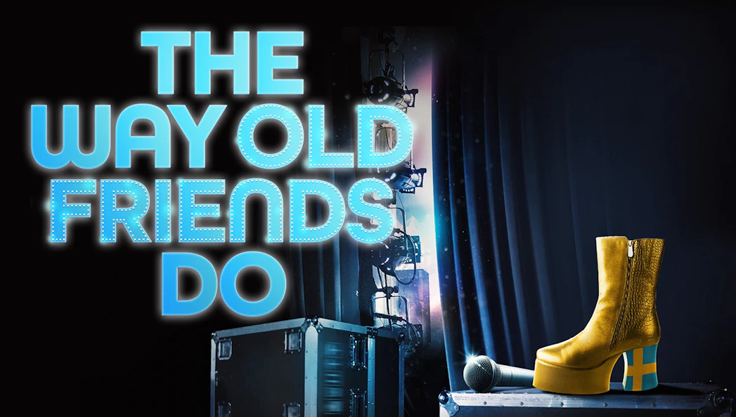 Stage setup with microphone, yellow platform boot, and "The Way Old Friends Do" text.