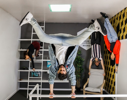 Visitors exploring interactive exhibits at Museum of Illusions, Madrid, with Skip The Line Tickets.