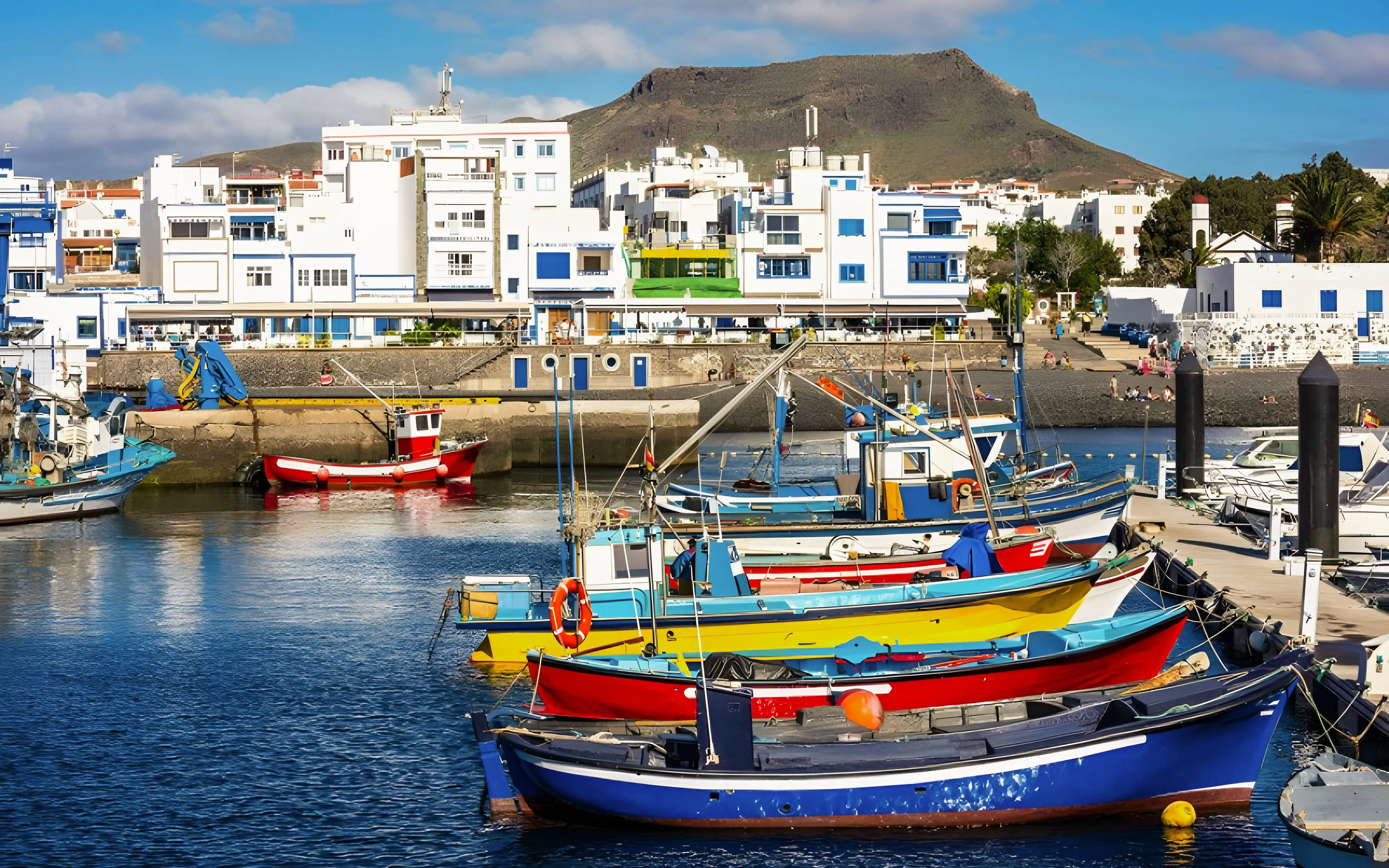 Fishing boats docked at the harbor of Puerto de las Nieves, Agaete, Gran Canaria, Canary Islands.