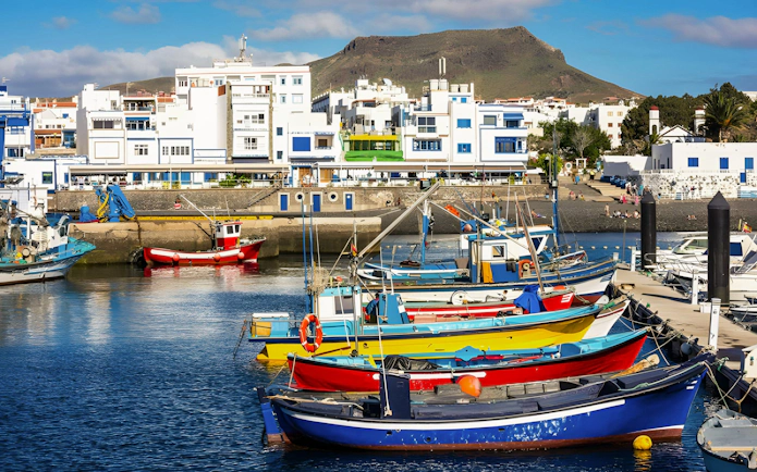 Fishing boats docked at the harbor of Puerto de las Nieves, Agaete, Gran Canaria, Canary Islands.