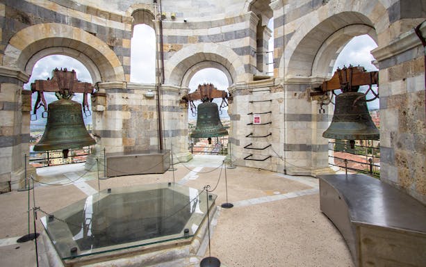 Leaning Tower of Pisa bell chamber with city view, part of Florence and Pisa tour.