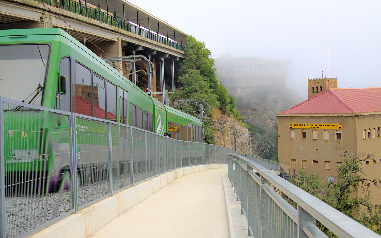 Sneak peak of montserrat rack railway on a foggy winter day