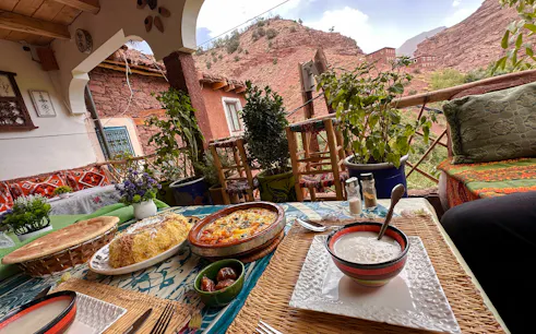 Traditional Berber meal on a terrace overlooking Megdaz village, Marrakesh day trip.