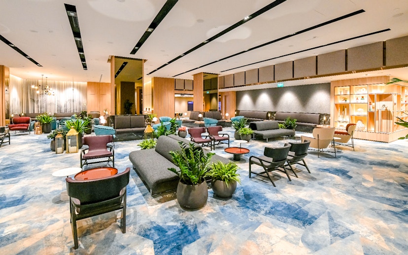 Changi Lounge interior with modern seating and plants, Singapore.
