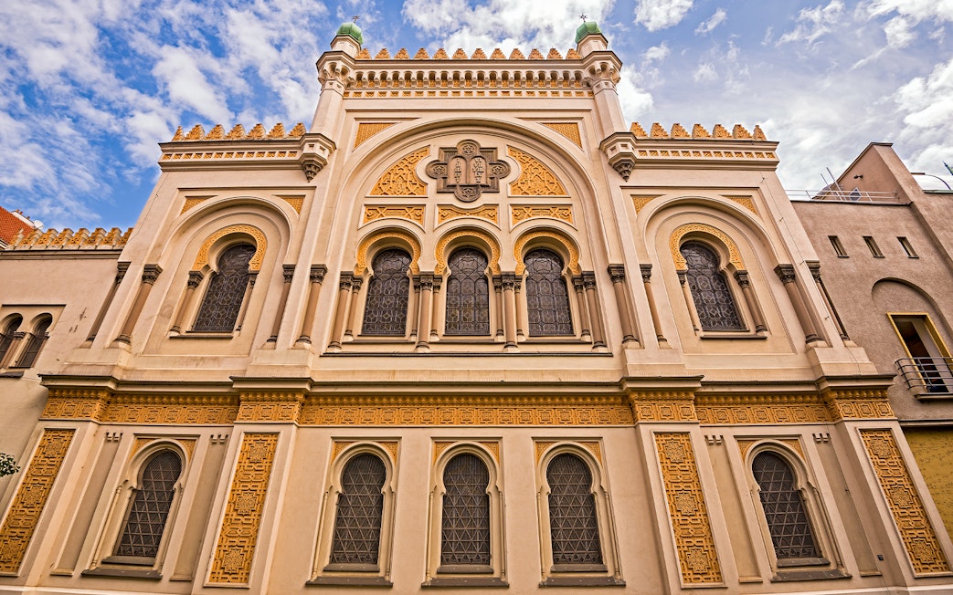 Spanish Synagogue facade in Prague, featuring ornate architectural details and arched windows.