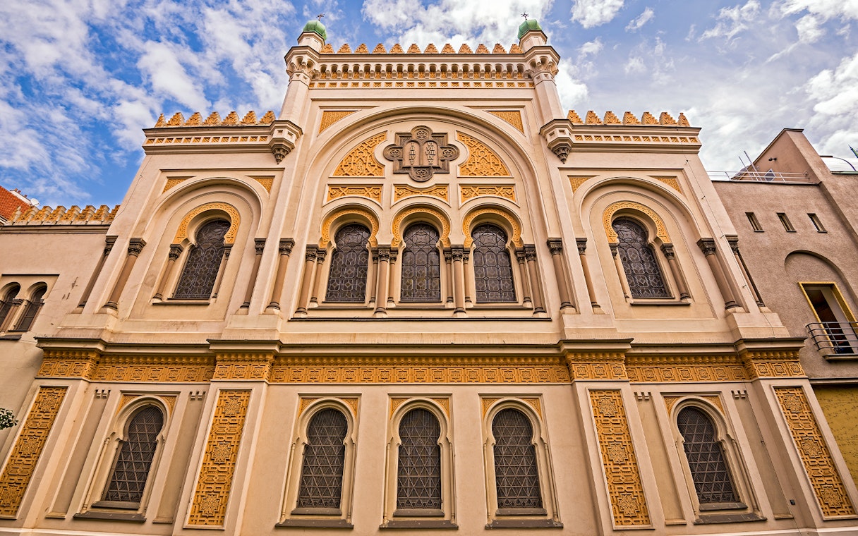 Spanish Synagogue facade in Prague, featuring ornate architectural details and arched windows.