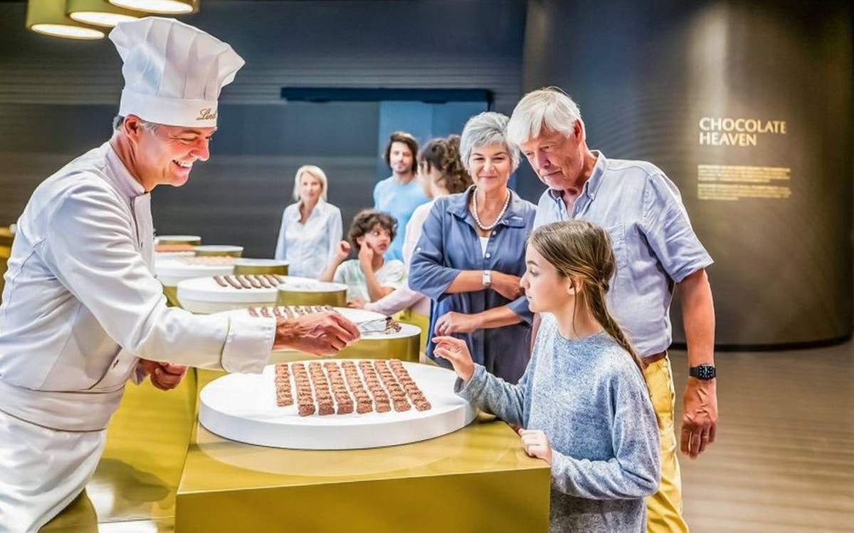 Visitors sampling chocolates at Lindt Home of Chocolate Museum.