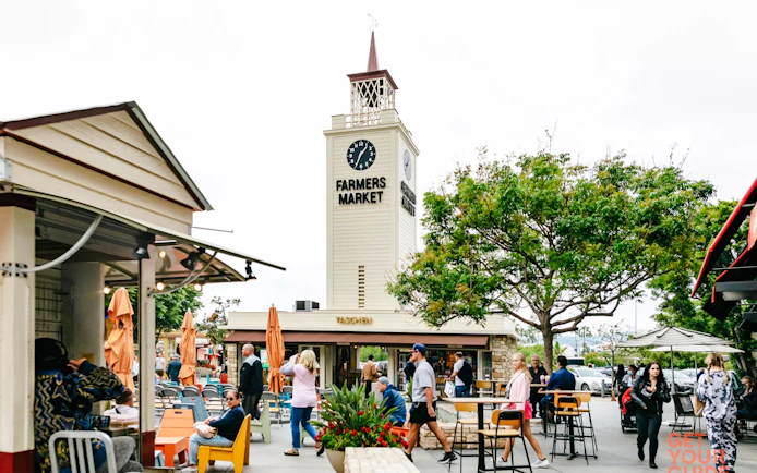 The Original Farmers Market clock tower and outdoor seating in Los Angeles, California.