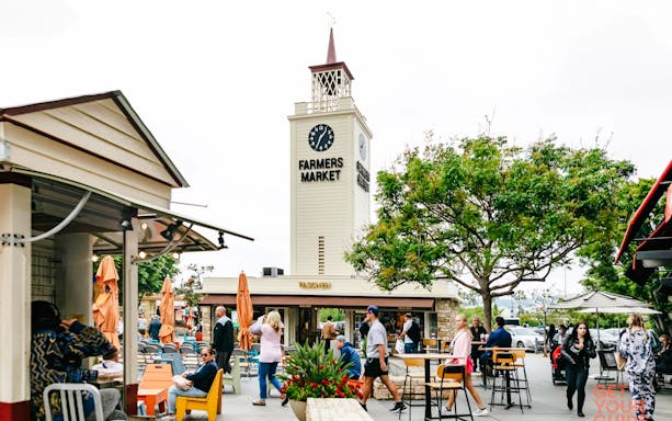 The Original Farmers Market clock tower and outdoor seating in Los Angeles, California.