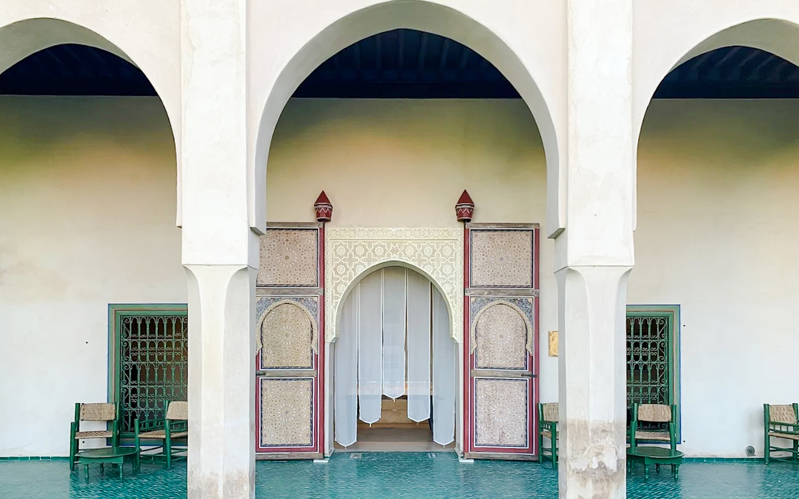 Interior archway and ornate doors at Le Jardin Secret, Marrakech, Morocco.