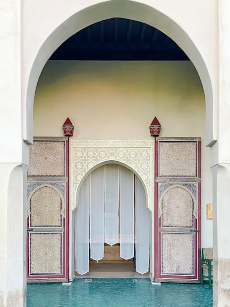 Interior archway and ornate doors at Le Jardin Secret, Marrakech, Morocco.