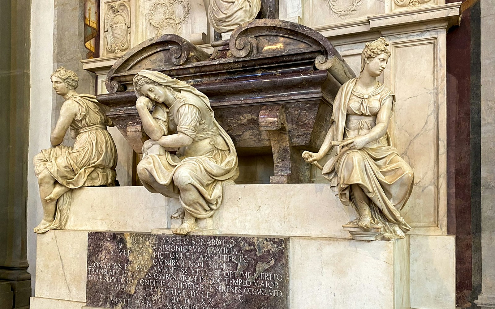 Santa Croce sculptures in Florence, featuring detailed marble figures on a tomb.