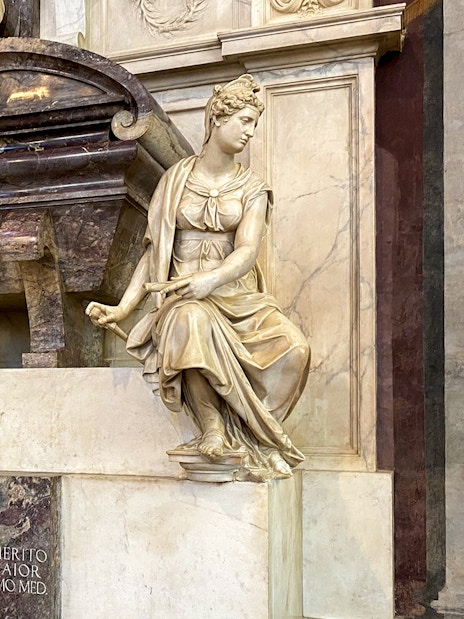 Santa Croce sculptures in Florence, featuring detailed marble figures on a tomb.