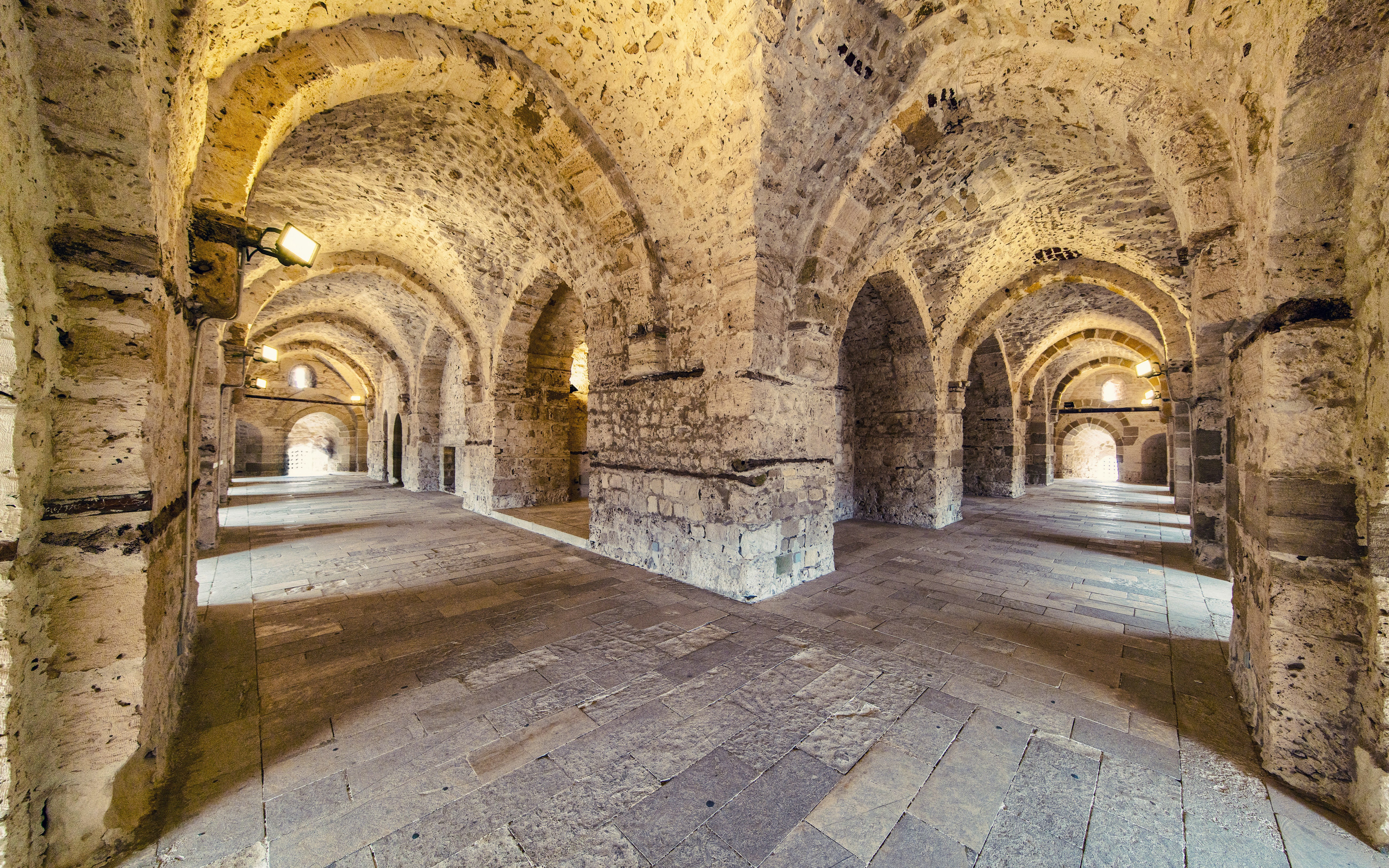 Interior view of Citadel of Qaitbay in Alexandria showcasing historic stone walls and arched passageways.