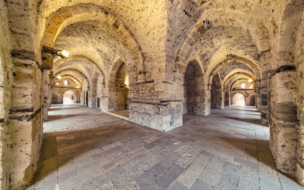 Interior view of Citadel of Qaitbay in Alexandria showcasing historic stone walls and arched passageways.
