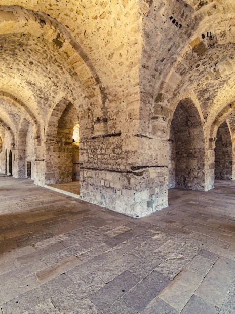 Interior view of Citadel of Qaitbay in Alexandria showcasing historic stone walls and arched passageways.