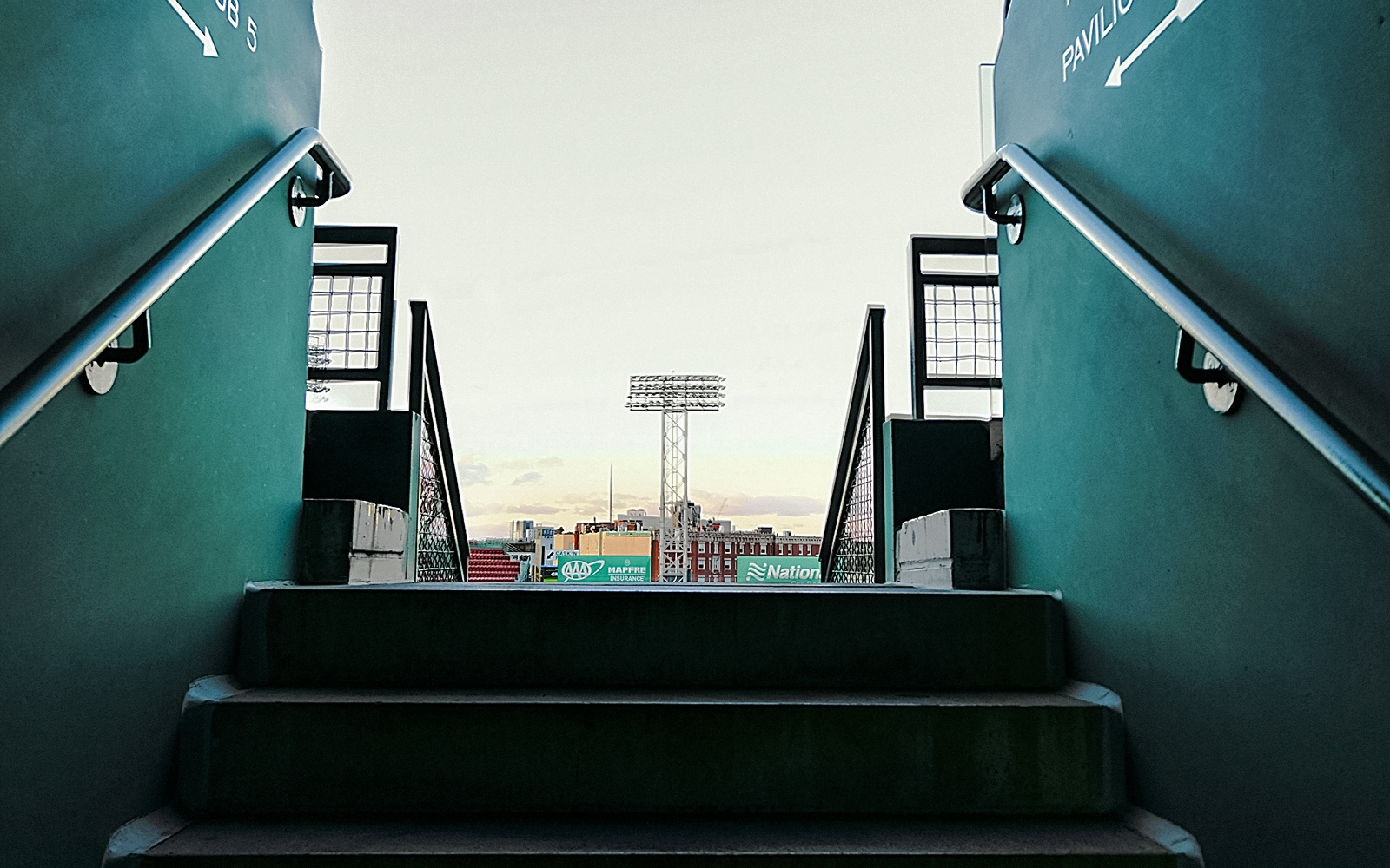 Fenway Park stairs leading to the stadium view with light tower in Boston.